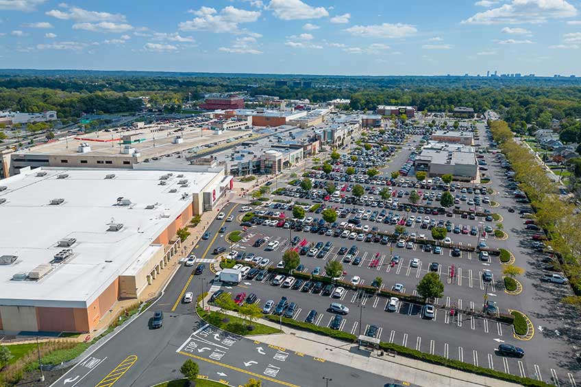 Overhead shot of Bergen Town Center shopping center and its adjacent parking lot, captured from a high vantage point.