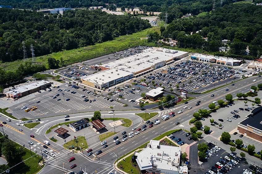 Aerial view of Briarcliff Commons shopping center and its adjacent parking lot, captured from a high vantage point.