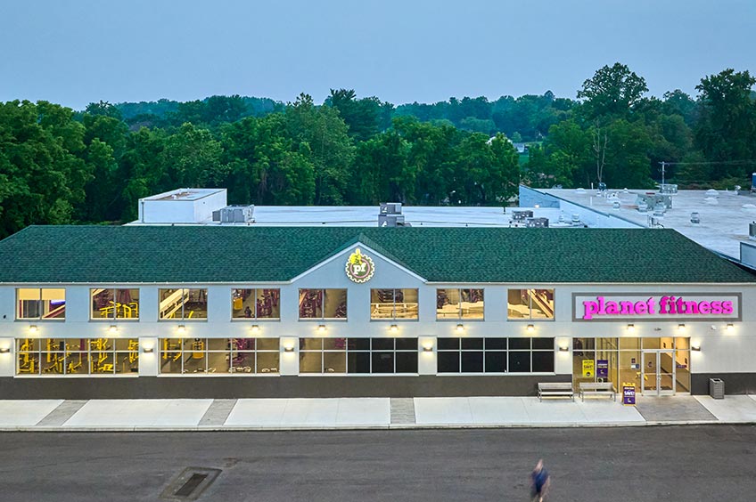 Sidewalk and shop storefront at Broomall Commons shopping center.