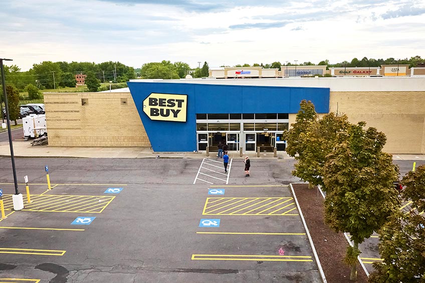 Image of Dewitt shopping center and parking spaces.