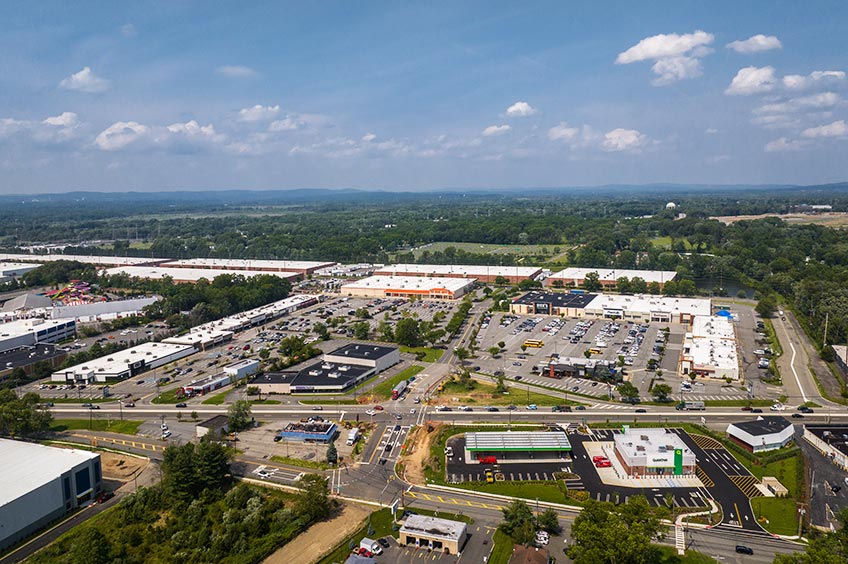 Aerial view of Hanover Commons shopping center and its adjacent parking lot, captured from a high vantage point.