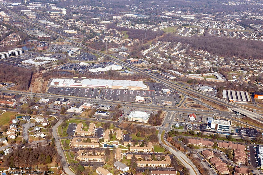 Aerial view of Marlton Commons shopping center and its adjacent parking lot, captured from a high vantage point.