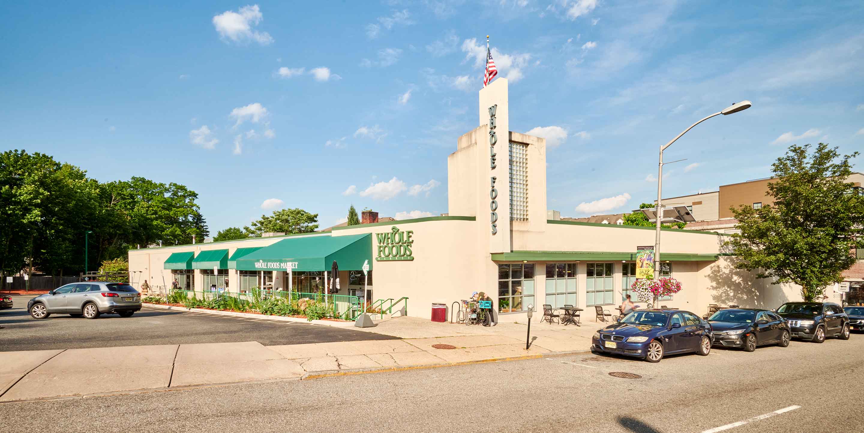 Image of Montclair shopping center with various shops and parking spaces.