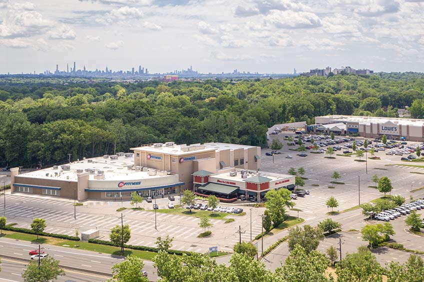 Aerial view of Paramus shopping center and its adjacent parking lot, captured from a high vantage point.