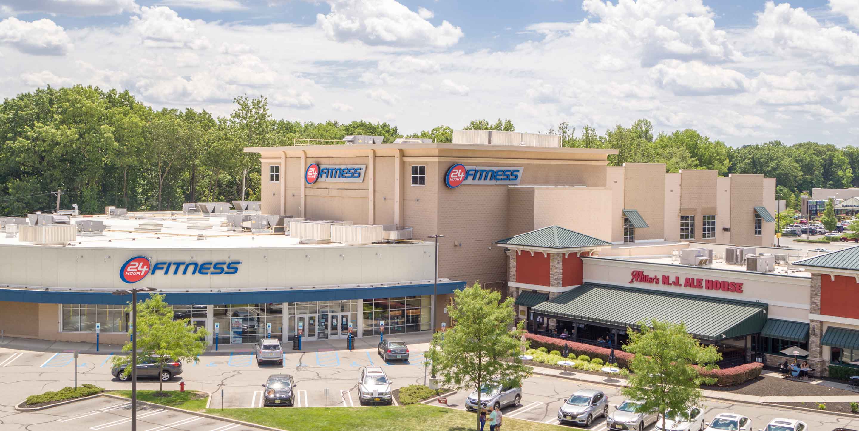 Image of Paramus shopping center with various shops and parking spaces.