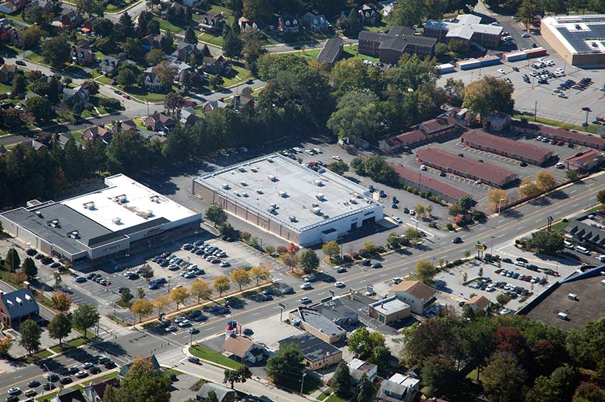 Aerial view of Springfield shopping center and its adjacent parking lot, captured from a high vantage point.