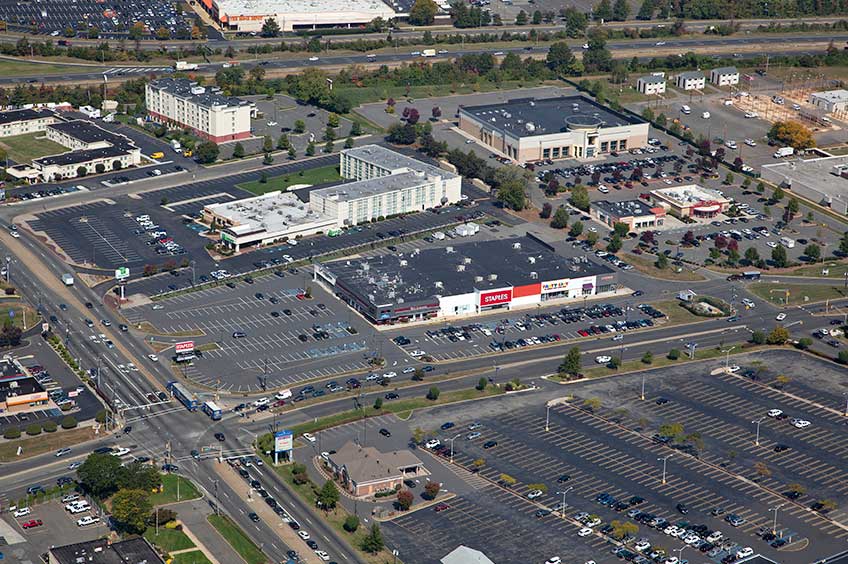 Aerial view of Stelton Commons shopping center and its adjacent parking lot, captured from a high vantage point.