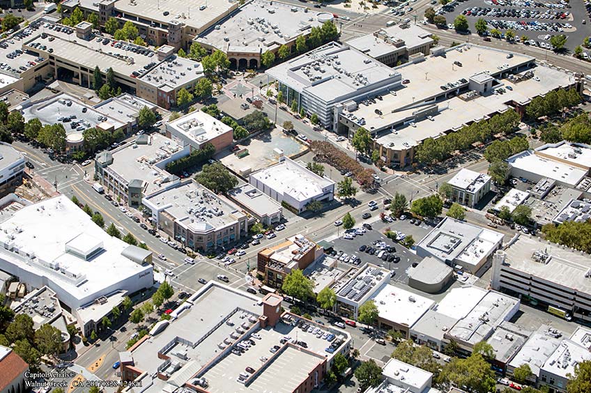 Aerial view of Walnut Creek - South Main shopping center and its adjacent parking lot, captured from a high vantage point.