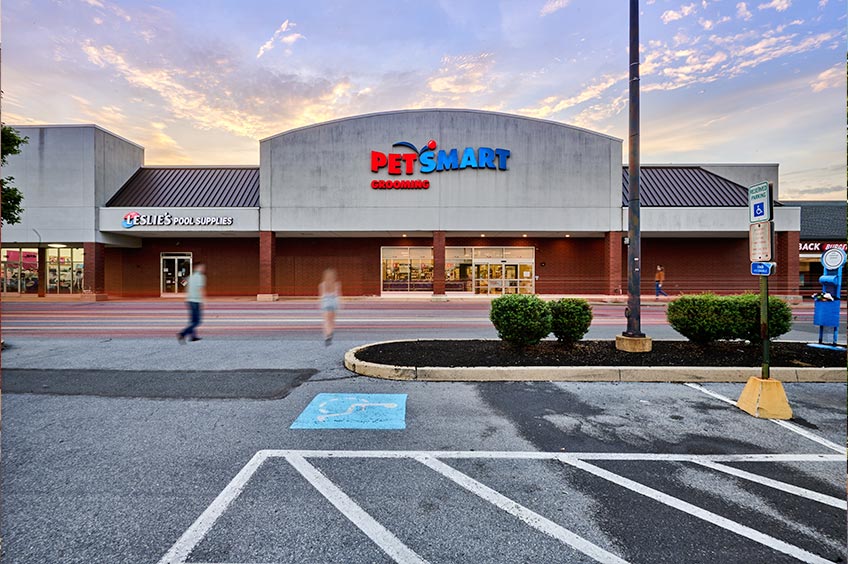 Storefront at Wyomissing shopping center with parking spaces.