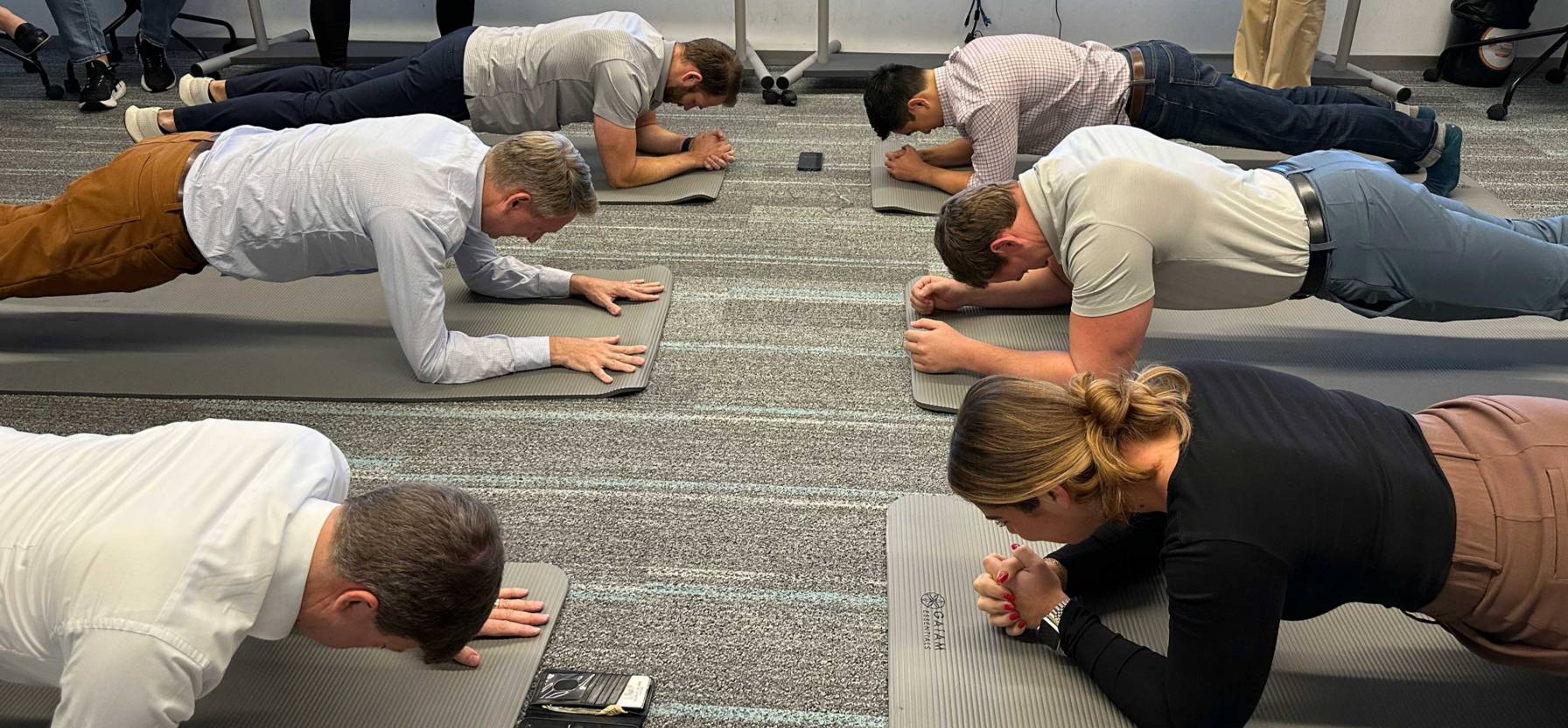 Staff members going a plank