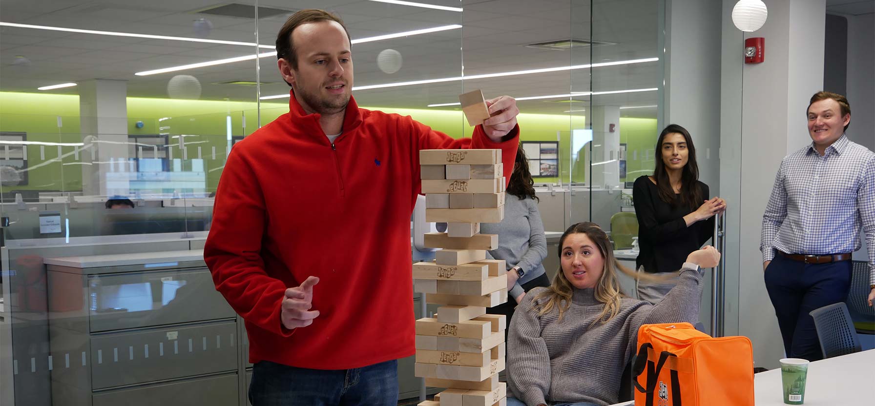 Staff playing activity with stacked blocks
