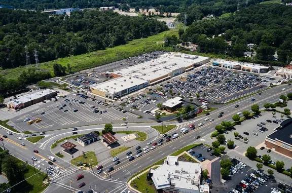 Aerial view of Briarcliff Commons shopping center and its adjacent parking lot, captured from a high vantage point.