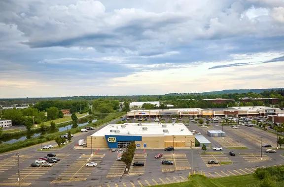 View of Dewitt shopping center with various parking lots.