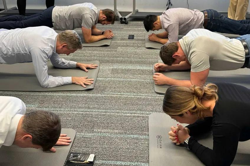 Staff members going a plank