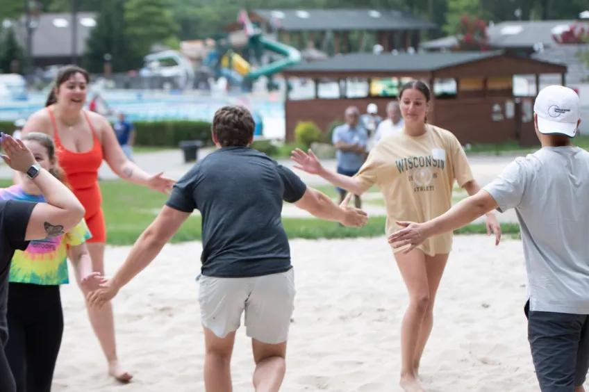 Staff members celebrating a win at an outdoor event
