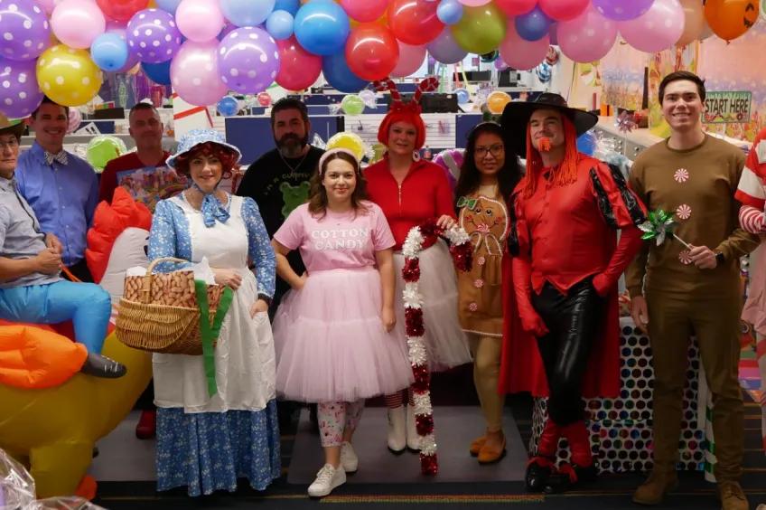 Group photo of staff members in costumes